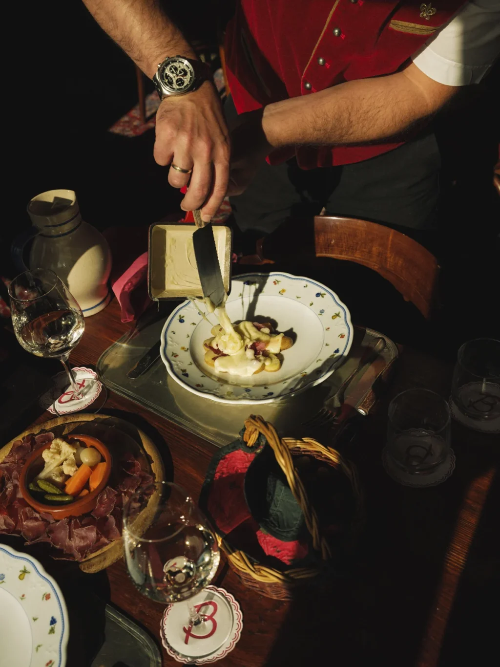 Raclette being served at Bar à Fromage, another restaurant of Hotel Bellevue
