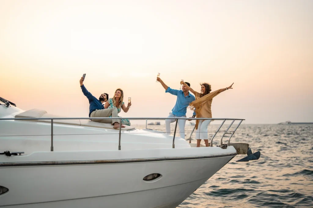 Diverse Friends Celebrating with Champagne and Selfie on Yacht in Dubai